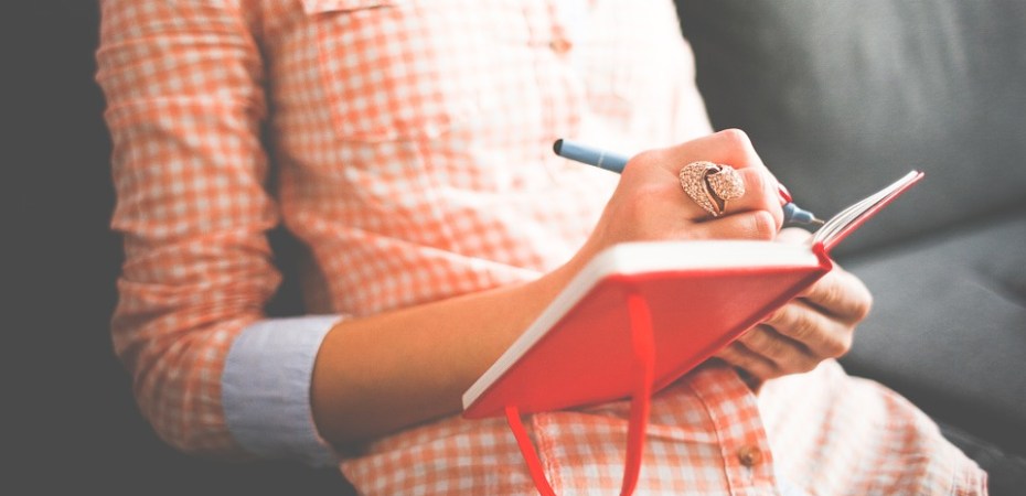woman writing in diary