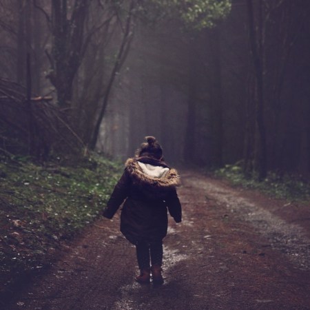 Girl Walking in Forest