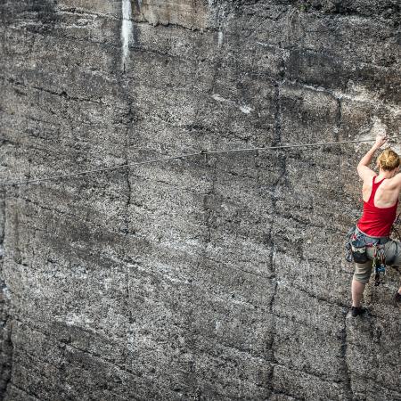 Woman Climbing Mountain